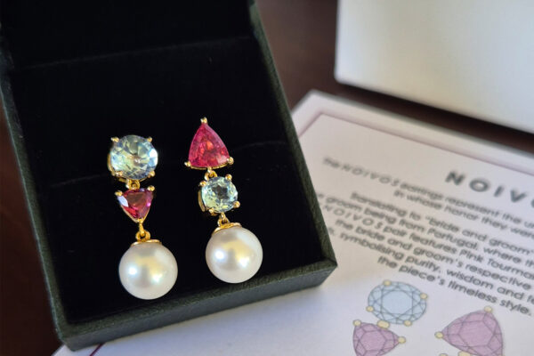 Round shape aquamarines, trilion shape pink tourmalines & freshwater pearls on 18k yellow gold.