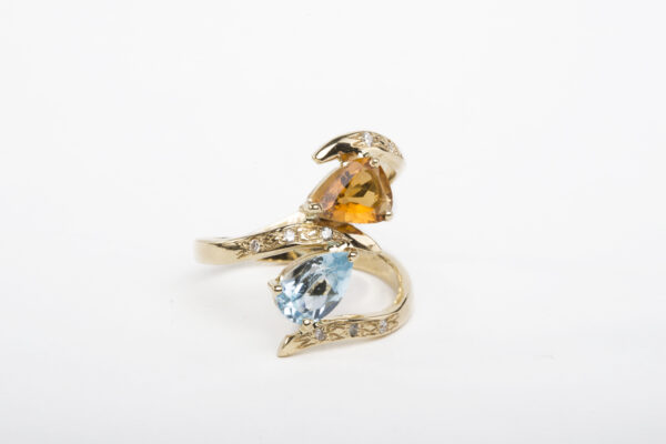 18k gold, pear shaped tourmaline, pear shaped blue topaz & white diamonds. Handmade ciselé details.